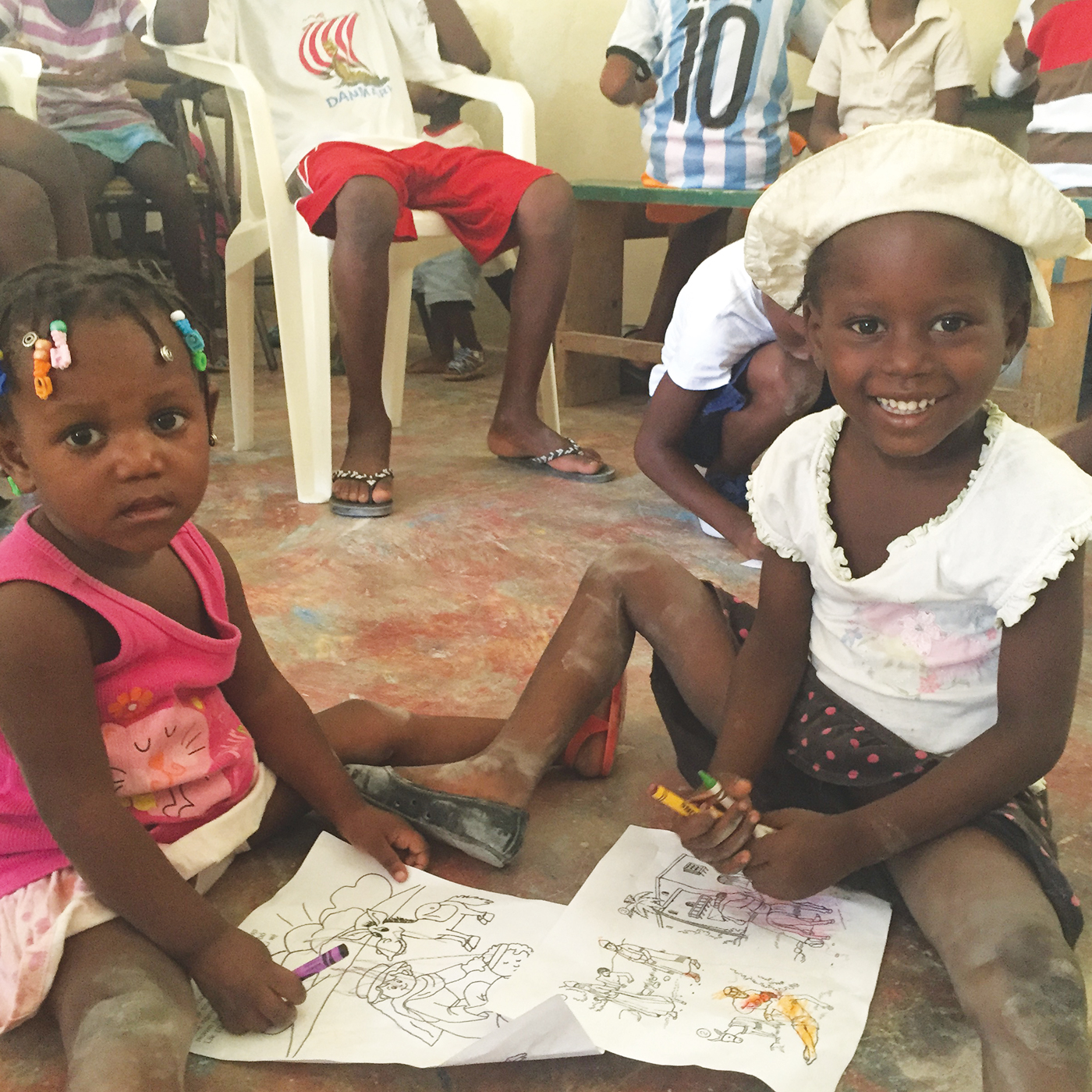 Two children coloring in Vacation Bible School